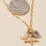 Gold Pearl Studded Cross And Charms Chain Necklace