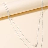 Silver Pearl And Cross Charm Layered Chain Necklace