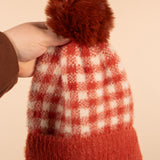 Fuzzy Pompom Plaid Beanie in Rust